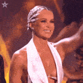 a woman in a white dress with a star in the corner