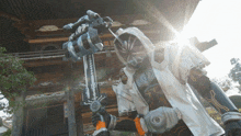 a man in a robot costume holds a large sword