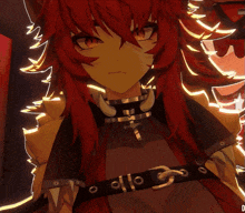 a girl with red hair is wearing a black belt