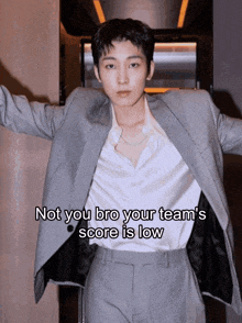 a man in a suit says not you bro your team 's score is low while standing
