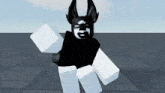 a black and white roblox character with horns and a white face is standing on a tiled floor .