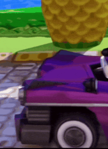 a purple car with white tires is parked on a sidewalk