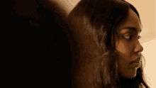 a close up of a woman 's face with a blurred background .