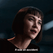 a close up of a woman 's face with the words it was an accident below her