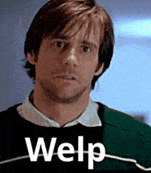 a man is wearing a green sweater with the word welp on the bottom