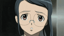 a close up of a girl wearing glasses and making a sad face