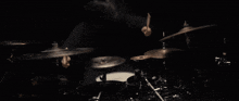 a man is playing a drum set with a cymbal that says sabian
