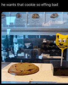 a picture of a cookie and a lollipop that says he wants that cookie so effing bad