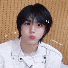 a close up of a person 's face with a sticker that says yummmmmm