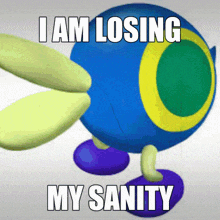 a blue ball with a yellow circle around it and the words i am losing my sanity