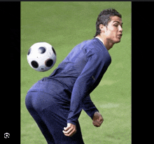 a man in a blue shirt is bending over to throw a soccer ball