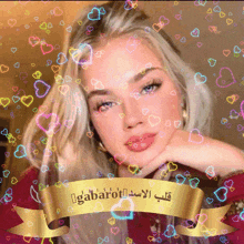 a woman is surrounded by colorful hearts and a gold ribbon that says gabanot