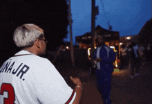 a man wearing a jersey that says una jr. on the back