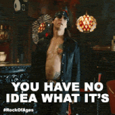 a man without a shirt stands in front of a sign that says you have no idea what it 's