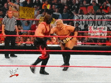 two wrestlers are in a ring with a sign that says sucks 4 you albert