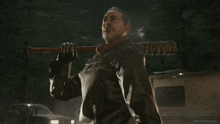 a man holding a baseball bat with the words easy peasy lemon squeezed above him