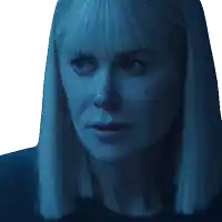 a close up of a woman 's face in a blue light