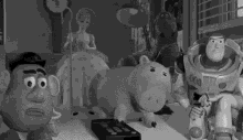 black and white toy story toys watching tv watching