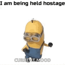 a minion wearing goggles is dancing and saying `` i am being held hostage '' .
