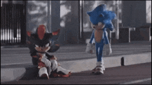 sonic the hedgehog and shadow the hedgehog are standing next to each other on the sidewalk .