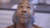 a man in a dental chair is looking up at the sky .