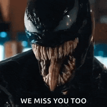 a close up of venom with a long tongue sticking out and the words `` we miss you too '' .