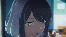 a close up of a girl 's face with green eyes