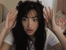 a girl with a star on her face is making a face