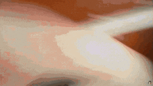 a close up of a person 's shoulder with a piercing in it