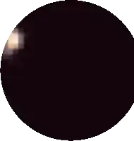 a black circle with a few pink squares on it