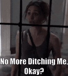 a woman is standing in front of a window with the words `` no more ditching me , okay ? '' .