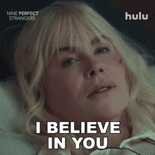 a woman laying in bed with the words " i believe in you " on the bottom