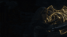 a silhouette of a person holding a torch in the dark