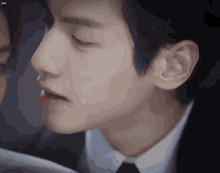 a close up of a man 's face with the word just on the bottom