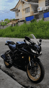 a black yamaha motorcycle is parked on the side of a road