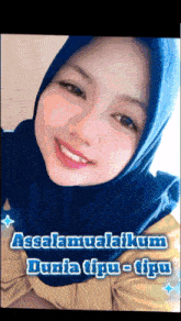 a picture of a woman wearing a blue hijab with the words assalamualaikum dunia tipiu-tipu
