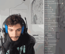 a man wearing headphones and a microphone is looking at a screen with a bunch of comments on it