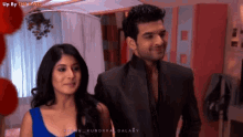 a man and a woman are standing next to each other with the caption up by the king on the bottom