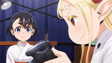 two anime girls are looking at each other and one is holding a black object
