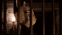 a cartoon character behind bars with a mask on