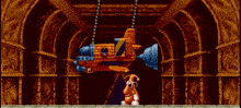 a video game scene with a cartoon character standing next to a large object that looks like a submarine