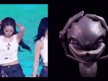 a woman in a white tank top is dancing next to a cartoon character