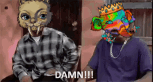 a man in a plaid shirt is sitting next to a man with a colorful face and the words damn !!!