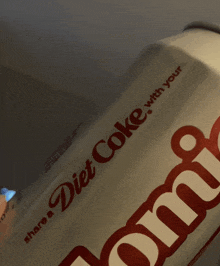 a close up of a diet coke can that says share a diet coke with your