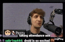 a man is wearing headphones and holding a microphone while talking into it