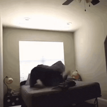 a person is laying on a bed in a bedroom
