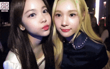 two girls are posing for a picture with the letters cd on the bottom left