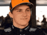 a young man wearing a hilton for the stay hat