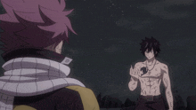 a man with a scarf around his neck is standing next to another man with a shirtless body