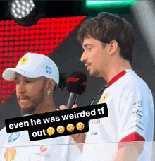 a man holding a microphone with the words even he was weirded tf out